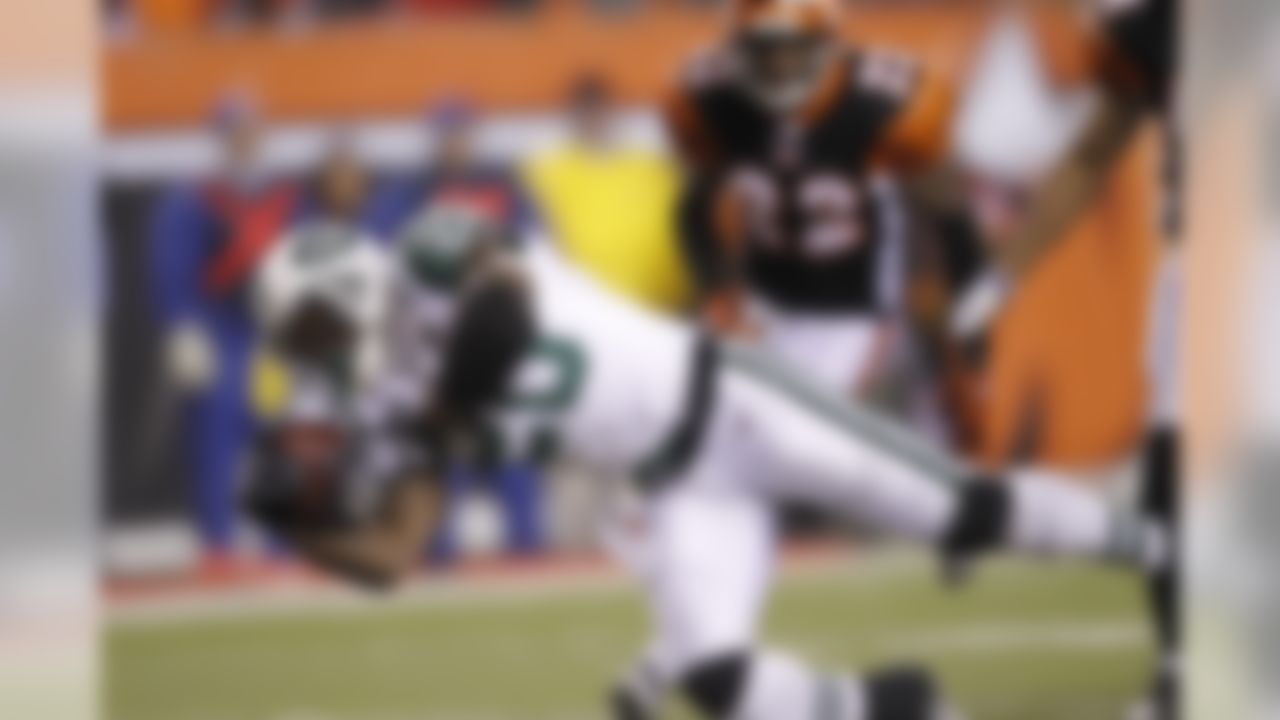 New York Jets running back Thomas Jones (20) dives for a second half touchdown against the Cincinnati Bengals in the AFC Wild Card Playoff game at Paul Brown Stadium in Cincinnati, Ohio on January 9, 2010. The Jets won 24-14. (Photo by Joe Robbins/NFL.com)