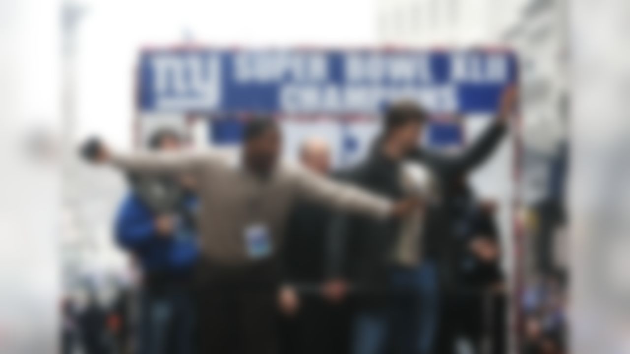 NEW YORK - FEBRUARY 05: (L-R) Michael Strahan, Head coach Tom Coughlin and Eli Manning of the New York Giants ride in a float along Broadway, also known as "The Canyon of Heroes" during Super Bowl XLII victory parade in New York City. (Photo by Al Bello/Getty Images)
