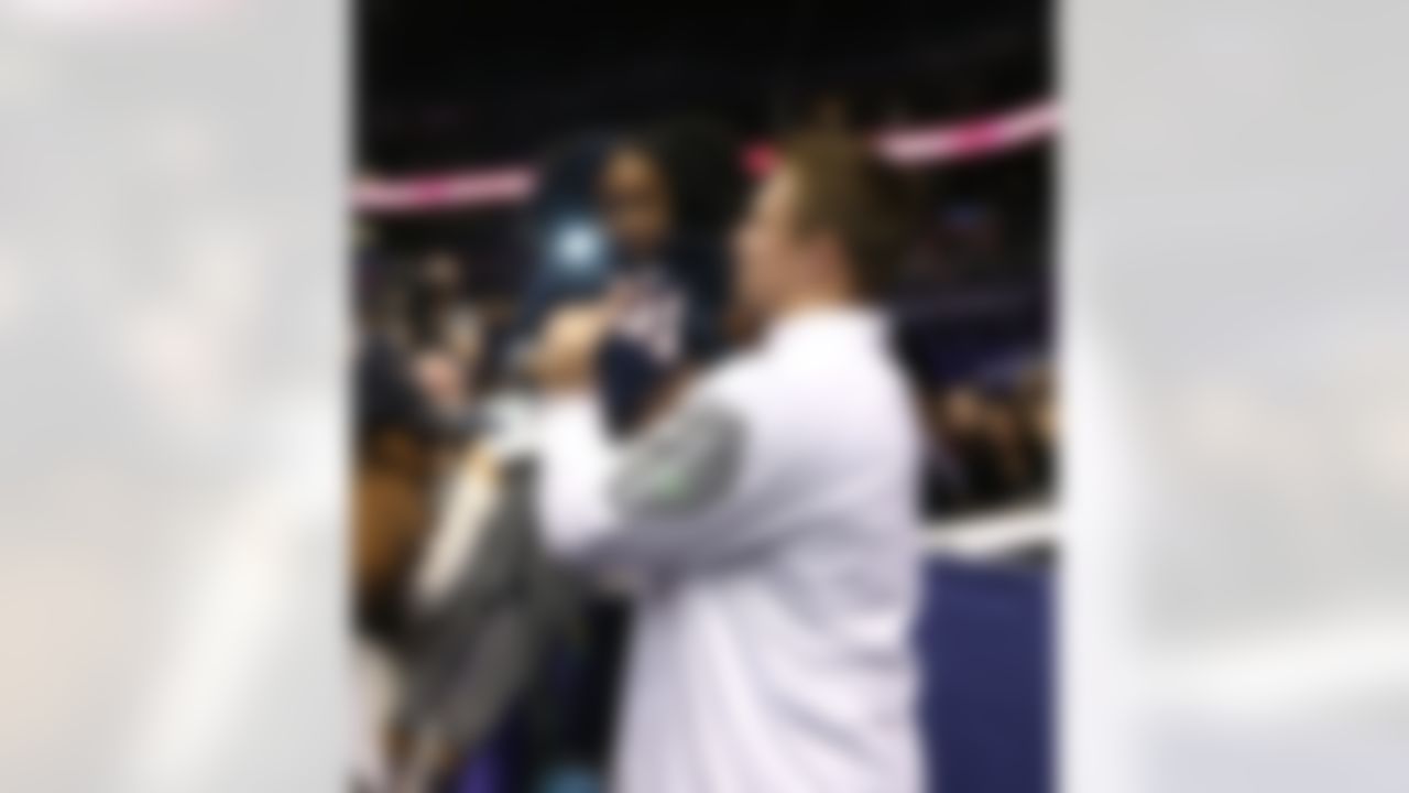 New England Patriots tight end Rob Gronkowski speaks with a young fan during Media Day for Super Bowl XLIX at the U.S. Airways Center on Tuesday, January 27, 2015 in Phoenix, AZ. (Perry Knotts/NFL)