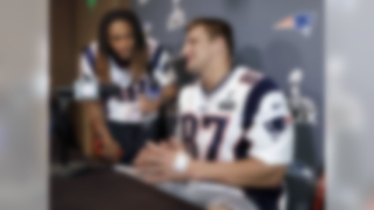 New England Patriots tight end Rob Gronkowski (87) is questioned about his favorite music by running back Brandon Bolden (38) during a news conference Thursday, Jan. 29, 2015, in Chandler, Ariz. The Patriots play the Seattle Seahawks in NFL football Super Bowl XLIX Sunday, Feb. 1. (AP Photo/Mark Humphrey)