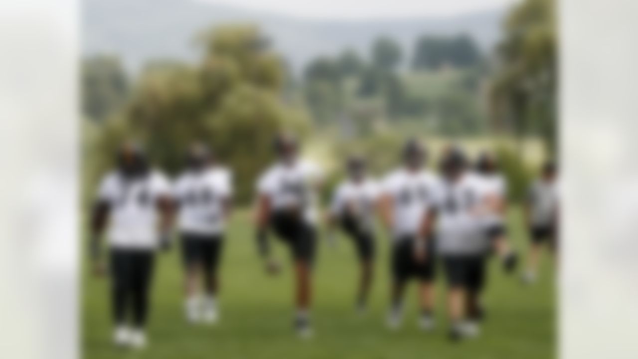 Pittsburgh Steelers tackle Mike Adams (76) stretches with the rest of the offensive line at the start of practice at the NFL football training camp in Latrobe, Pa., Thursday, July 26, 2012. (AP Photo/Keith Srakocic)