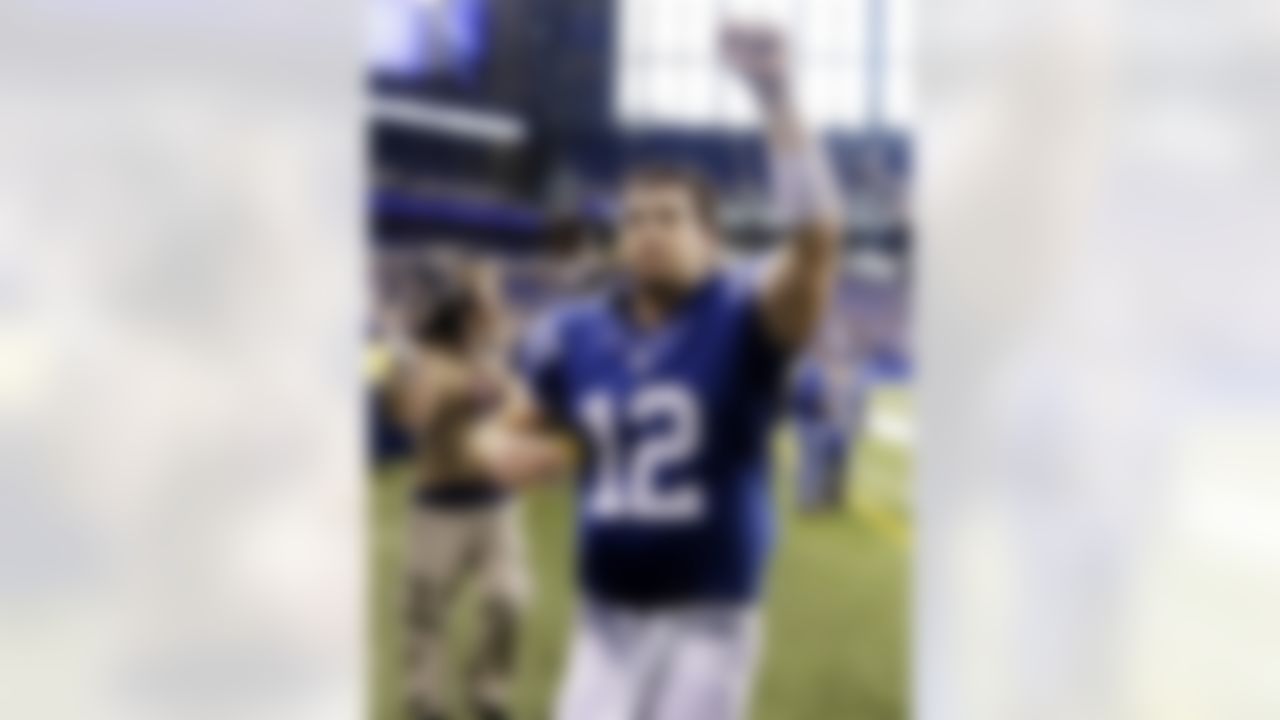 Indianapolis Colts quarterback Andrew Luck celebrates as he leaves the field following an NFL football game against the Miami Dolphins in Indianapolis, Sunday, Nov. 4, 2012. The Colts won 23-20. (AP Photo/Darron Cummings)