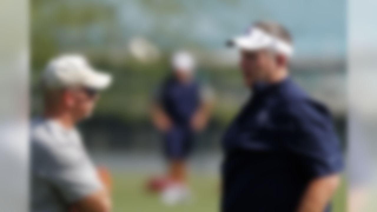 Tennessee Titans head coach Mike Munchak, right, talks with strength and conditioning coach Steve Watterson during an NFL football practice at Titans' headquarters Saturday, July 28, 2012 Nashville, Tenn. (AP Photo/Wade Payne)