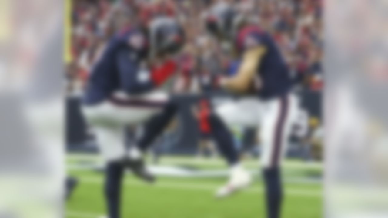 Houston Texans wide receiver Will Fuller (15) celebrates with wide receiver DeAndre Hopkins (10) after scoring a touchdown during the second quarter against the Tennessee Titans at NRG Stadium.