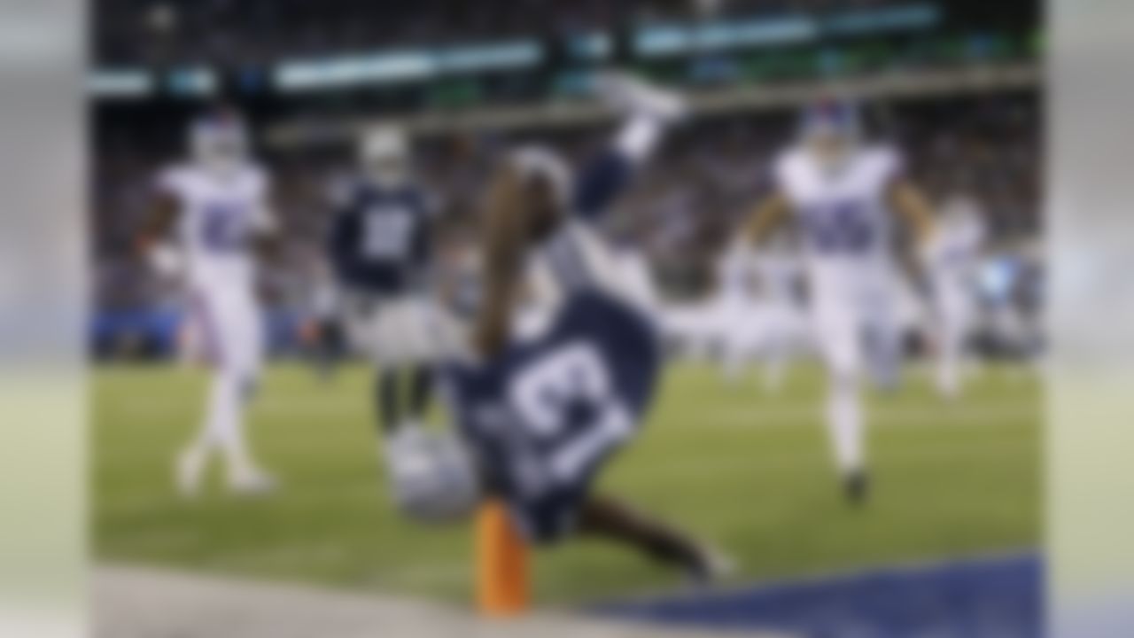 Dallas Cowboys wide receiver Michael Gallup (13) stays in bounds as he flips over the goal line to score a touchdown against the New York Giants during the fourth quarter of an NFL football game, Monday, Nov. 4, 2019, in East Rutherford, N.J. (AP Photo/Adam Hunger)