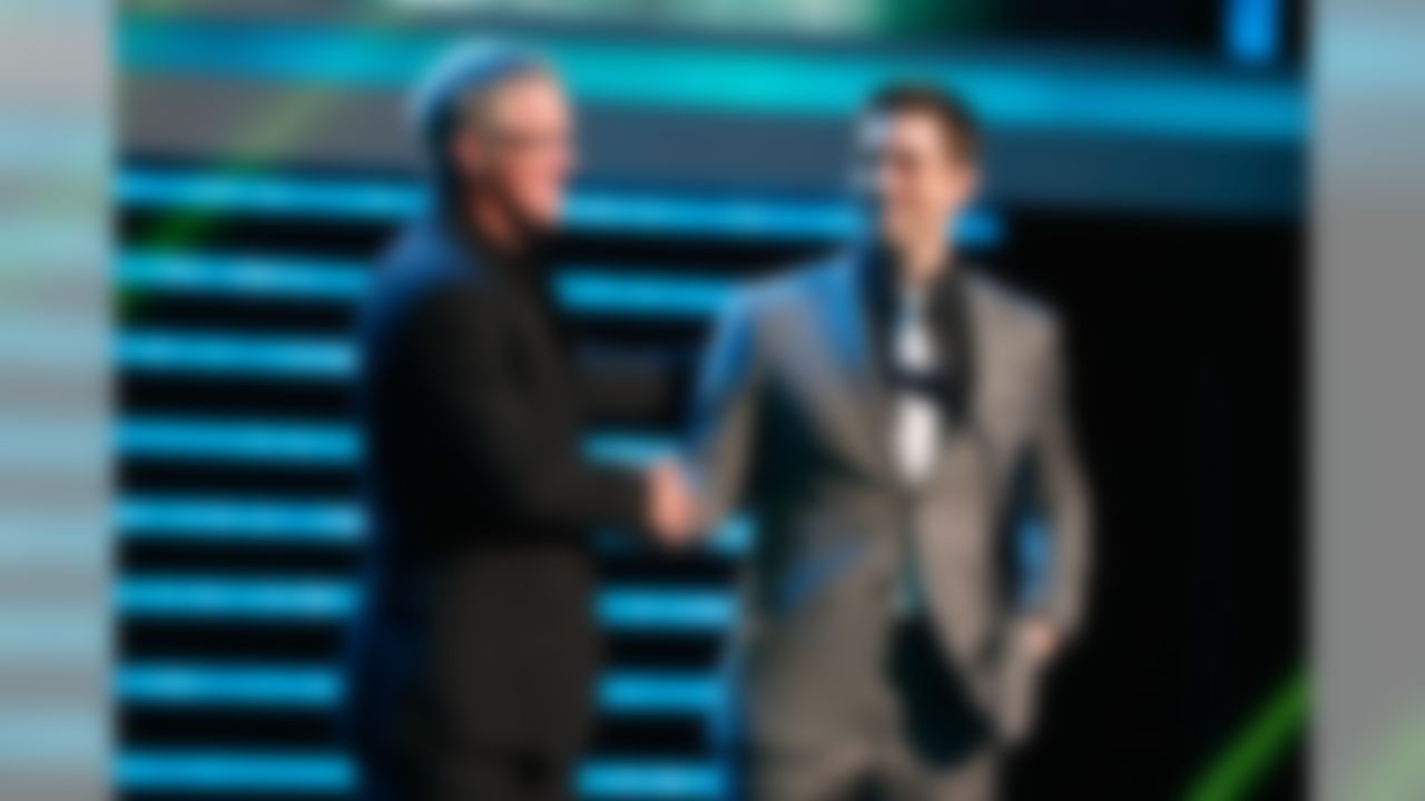 Former Green Bay Packers quarterback Brett Favre greets Packers quarterback Aaron Rodgers onstage during the NFL Honors awards show at the Mahalia Jackson Theatre on Saturday, February 2, 2013 in New Orleans, LA. (Perry Knotts/NFL)