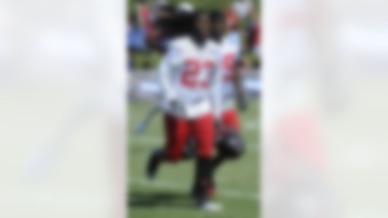 Atlanta Falcons cornerbacks Dunta Robinson, left, and Darrin Walls switch fields during a session at NFL football training camp, Saturday, July 28, 2012. (AP Photo/John Amis)