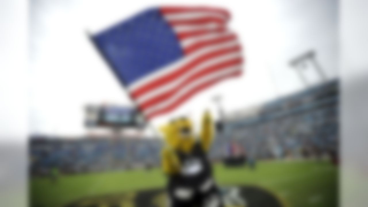 Jacksonville Jaguars mascot Jaxson de Ville waves a flag during opening ceremonies before the start of an NFL football game between the Jacksonville Jaguars and the Arizona Cardinals, Sunday, Nov. 17, 2013, in Jacksonville, Fla. The Cardinals beat the Jaguars 27-14. (AP Photo/Stephen Morton)