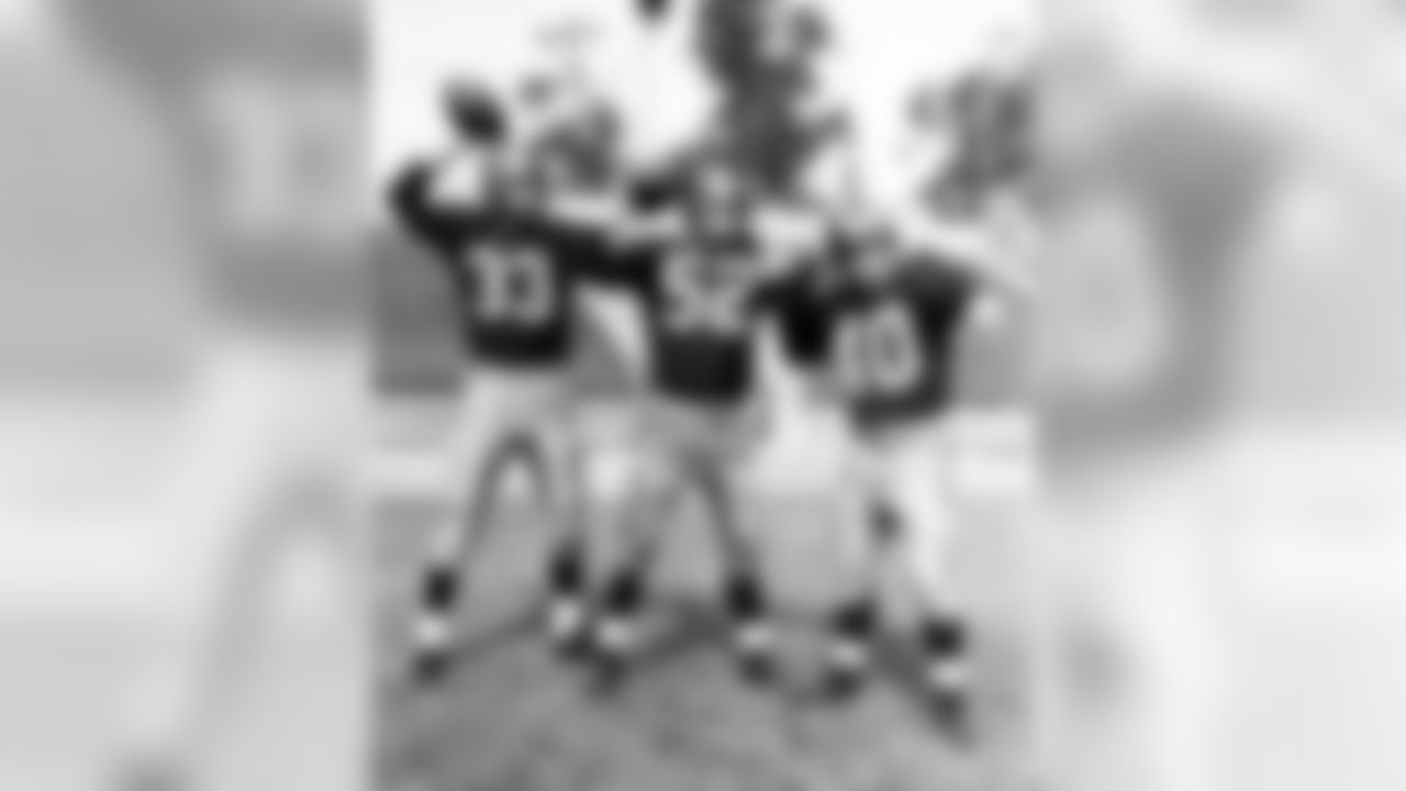 Washington Redskins Hall of Fame quarterback Sammy Baugh, quarterback Harry Gilmore, and quarterback Eddie LaBaron during training camp circa 1950's. (Nate Fine/NFL)