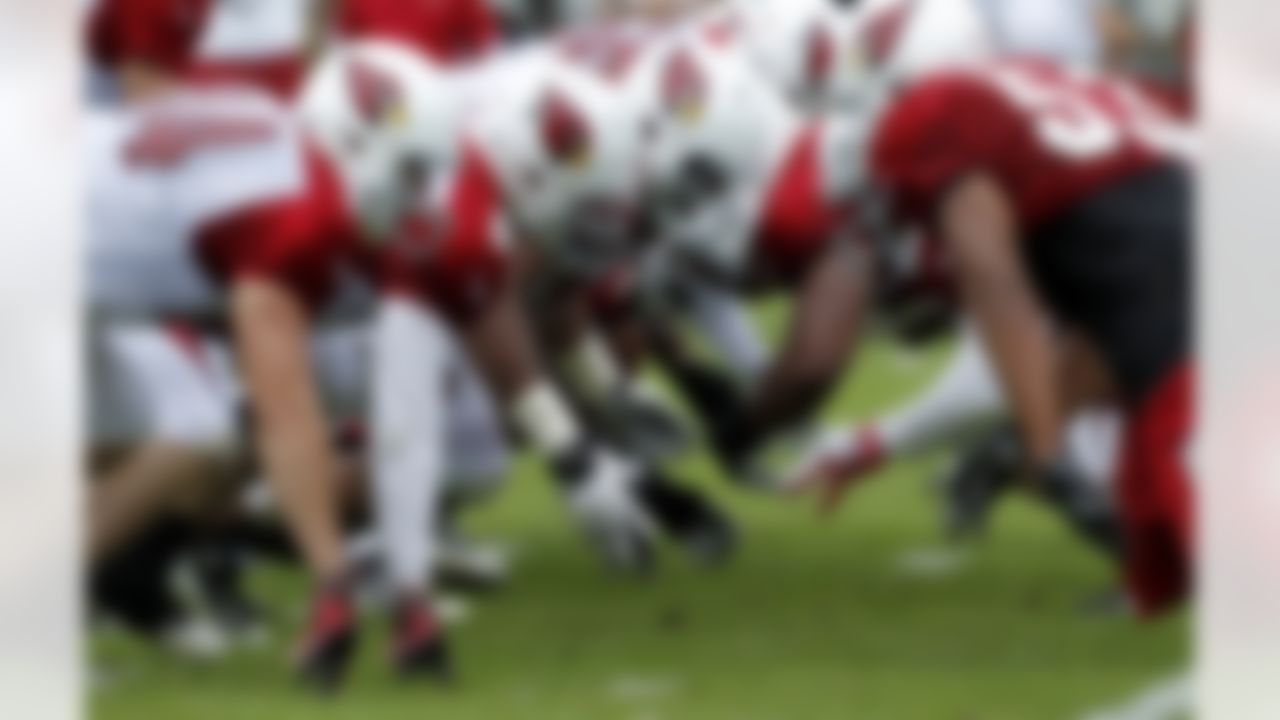 Arizona Cardinals players line up in their Red-White scrimmage during NFL training camp football practice at Northern Arizona University o Saturday, July 28, 2012, in Flagstaff, Ariz. (AP Photo/Ross D. Franklin)