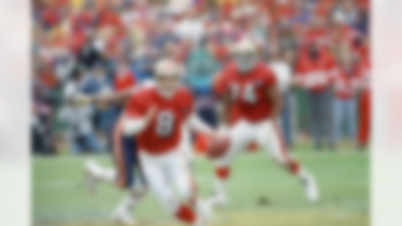 San Francisco 49ers quarterback Steve Young (8) scrambles for a 10-yard gain during the first half NFC divisional on Saturday, Jan. 7, 1995, against the Chicago Bears at Candlestick Park in San Francisco. (AP Photo/Paul Sakuma)