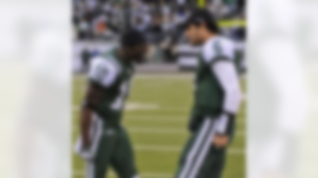 New York Jets quarterback Mark Sanchez (6) and teammate Santonio Holmes (10) celebrate after they connected for the game-winning touchdown during the fourth quarter of an NFL football game against the Houston Texans at New Meadowlands Stadium, Sunday, Nov. 21, 2010, in East Rutherford, N.J. The Jets won 30-27. (AP Photo/Bill Kostroun)