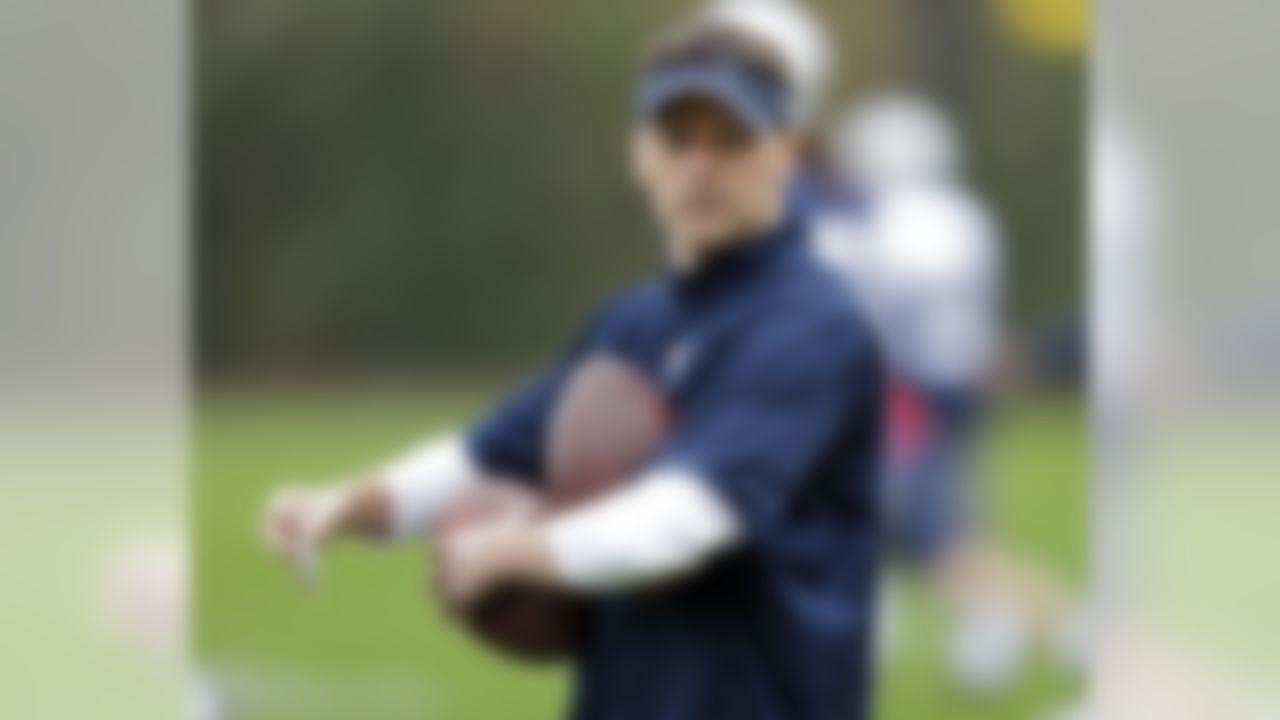 New England Patriots cornerbacks coach Josh Boyer holds footballs during practice Friday, Jan. 30, 2015, in Tempe, Ariz. The Patriots play the Seattle Seahawks in NFL football Super Bowl XLIX Sunday, Feb. 1. (AP Photo/Mark Humphrey)