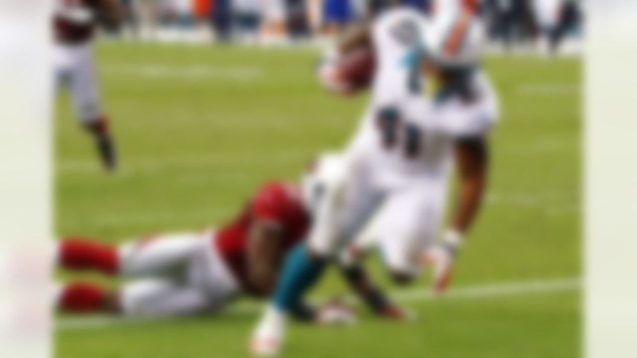 Miami Dolphins fullback Jorvorskie Lane (41) scores a 2-point conversion against the Arizona Cardinals during the second half of an NFL football game, Sunday, Sept. 30, 2012, in Glendale, Ariz. (AP Photo/Matt York)