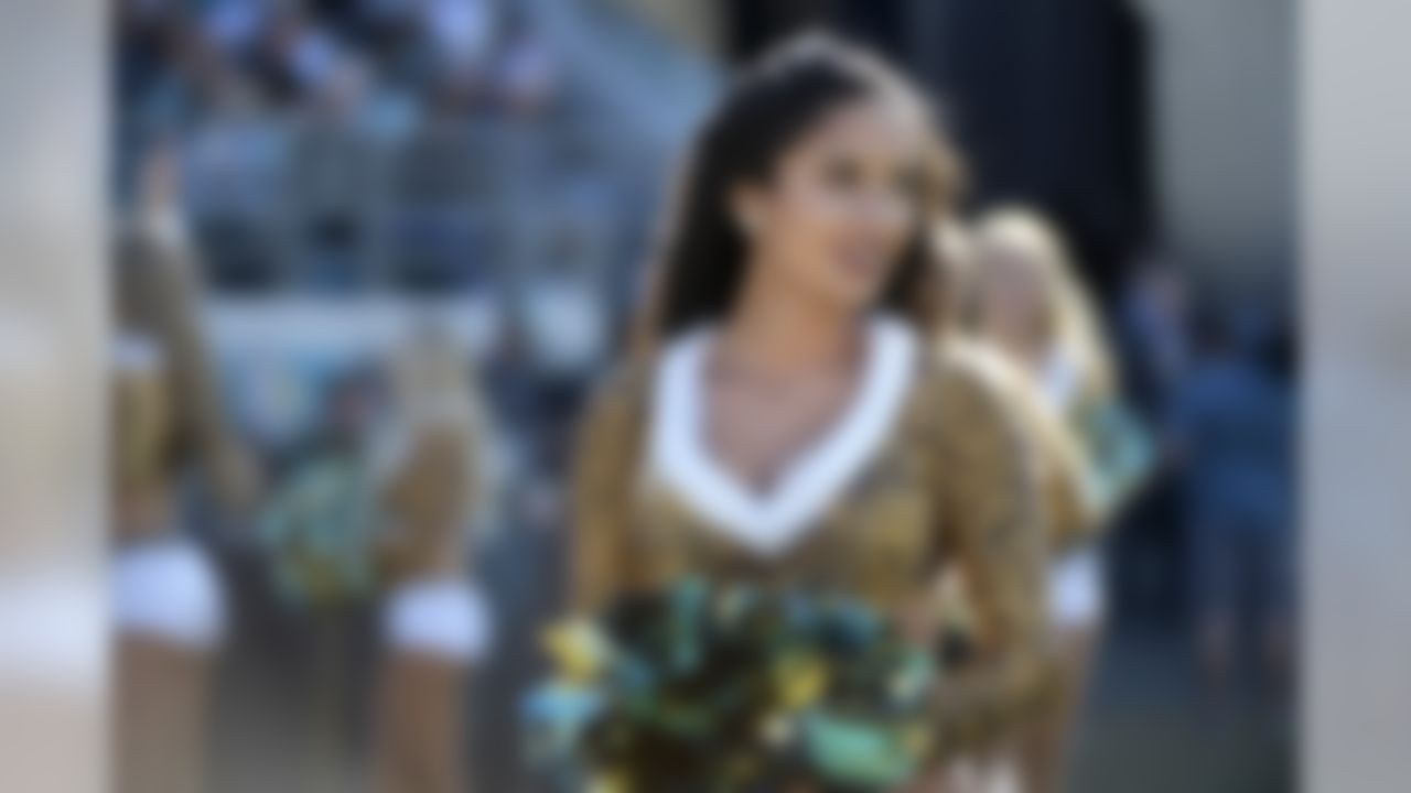 A cheerleader is seen before the first half of an NFL football