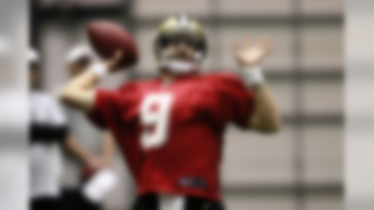 New Orleans Saints quarterback Drew Brees (9) works out during the first practice of NFL football training camp at their indoor training facility in Metairie, La., Thursday, July 26, 2012. (AP Photo/Gerald Herbert)
