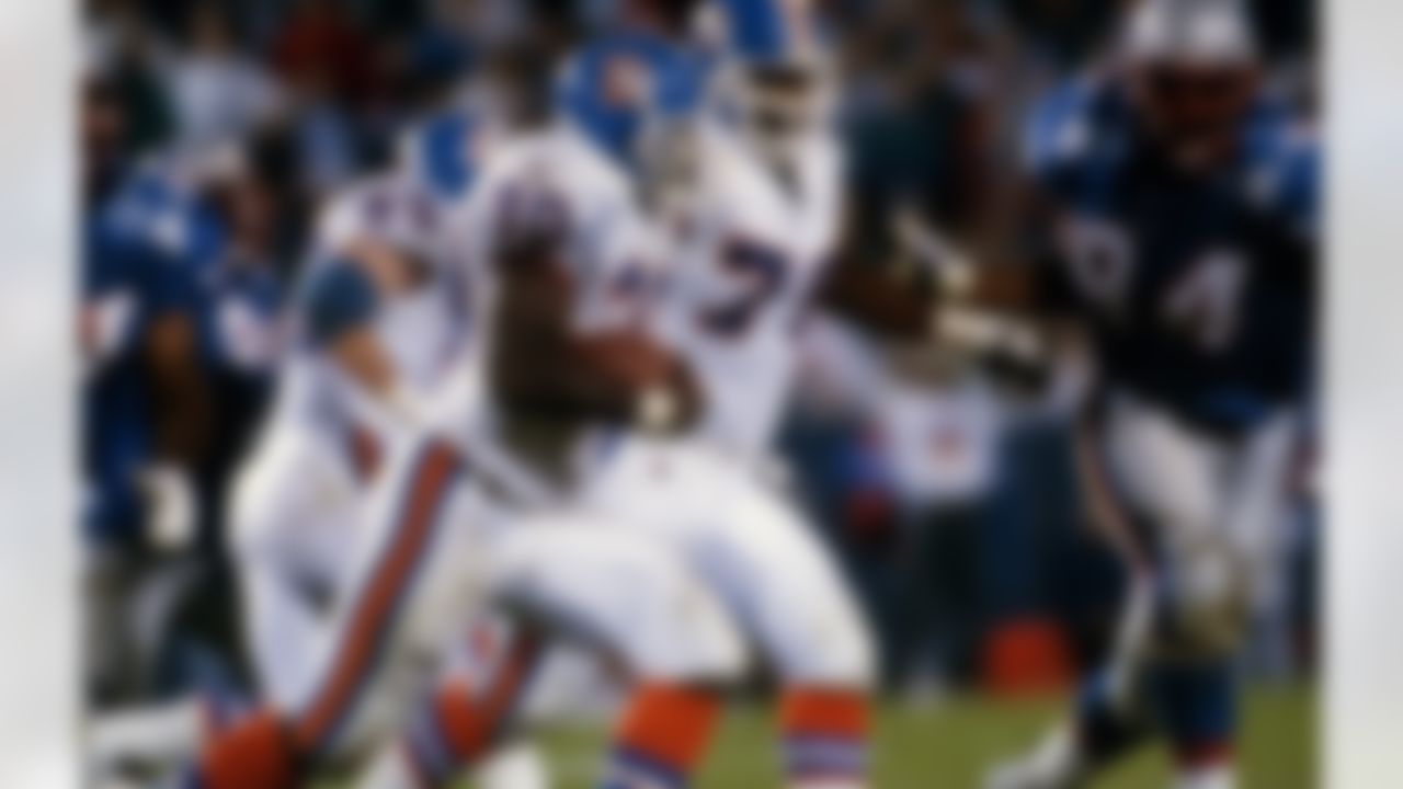 Denver Broncos running back Terrell Davis (30) runs upfield during an NFL game against the New England Patriots at Foxboro, Mass., Oct. 8, 1995. The Broncos defeated the Patriots 37-3. (AP Photo/Arthur Anderson)