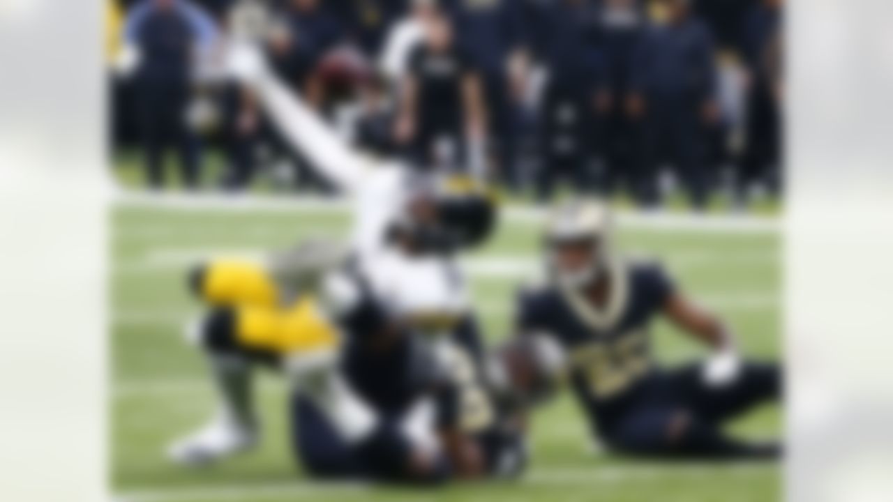 Pittsburgh Steelers wide receiver JuJu Smith-Schuster (19) fumbles the ball as New Orleans Saints defensive tackle Sheldon Rankins (98) tackles him, causing a turnover in the final minute of the second half of an NFL football game in New Orleans, Sunday, Dec. 23, 2018. The Saints won 31-28, clinching the top seed for the NFC and home-field advantage for the playoffs.