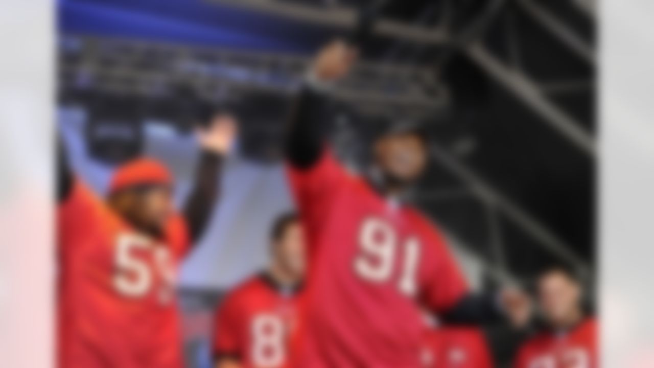 Tampa Bay Buccaneers linebacker Mason Foster and defensive end Da'Quan Bowers wave to the crowd at the NFL fan rally in Trafalgar Square, London on October 22, 2011. (Sean Ryan/NFL)