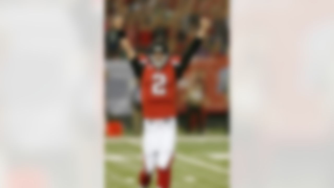 Atlanta Falcons quarterback Matt Ryan (2) raises his arms in the air as he celebrates a touchdown during a NFL NFC Divisional Playoff game against the Seattle Seahawks in Atlanta, Georgia on January 13, 2013. The Falcons defeated the Seahawks 30-28. (AP Photo/Scott Boehm)
