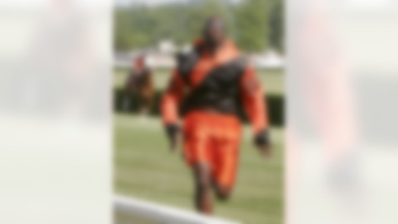 Cincinnati Bengals wide receiver Chad Johnson beats Restore The Roar, ridden by jockey P.J. Cooksey, by several lengths during a fundraising event for Feed The Children at River Downs, Saturday, June 9, 2007, in Cincinnati. (AP Photo/David Kohl)