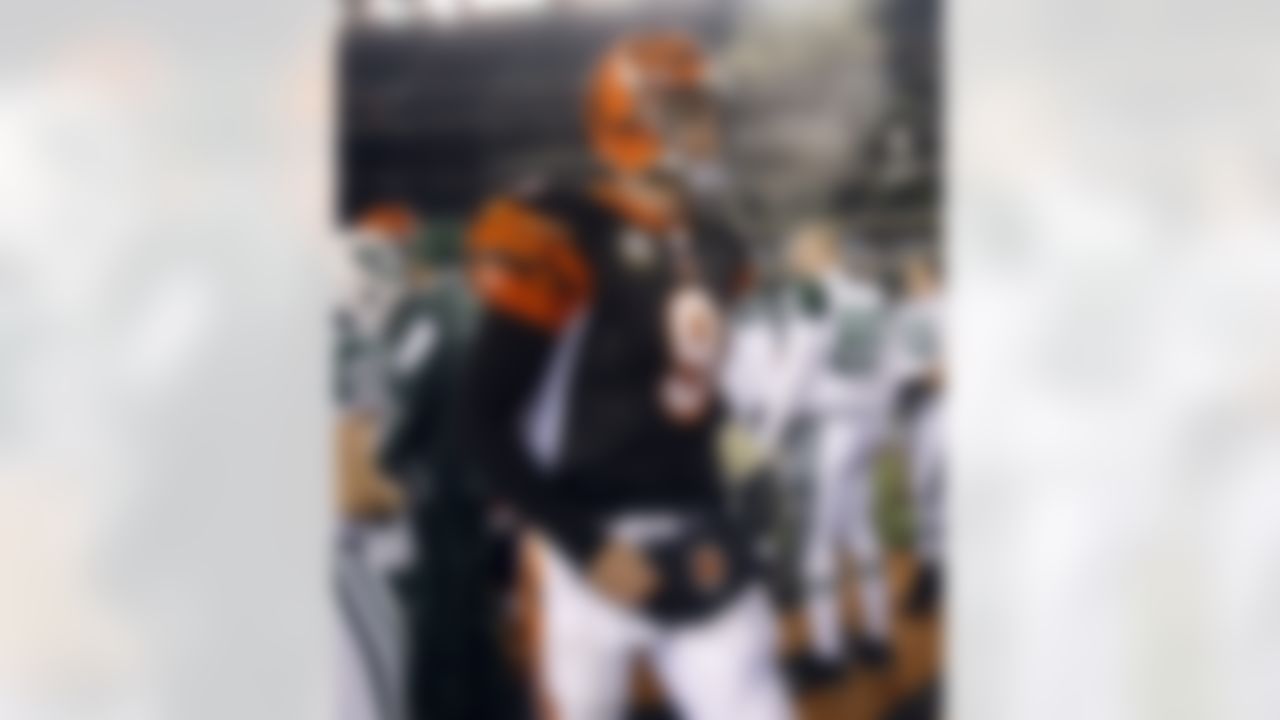 Cincinnati Bengals quarterback Carson Palmer (9) walks off the field after the New York Jets defeated the Bengals 24-14 in an NFL wild-card playoff football game, Saturday, Jan. 9, 2010, in Cincinnati. (AP Photo/Ed Reinke)