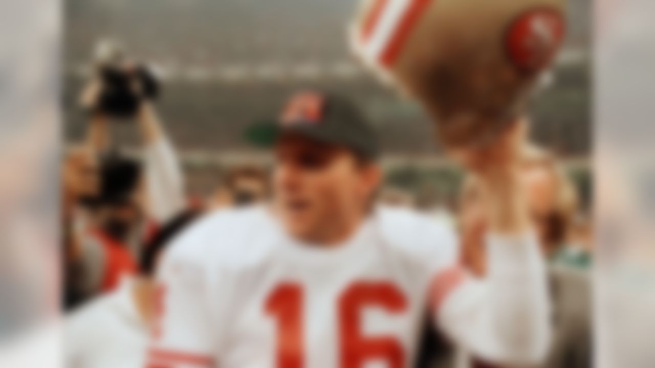 San Francisco 49ers quarterback Joe Montana raises his helmet toward the crowd as he leaves the field following the team's 55-10 victory over the Denver Broncos in Super Bowl XXIV in New Orleans, La., Jan. 28, 1990. (AP Photo/Lennox McLennon)