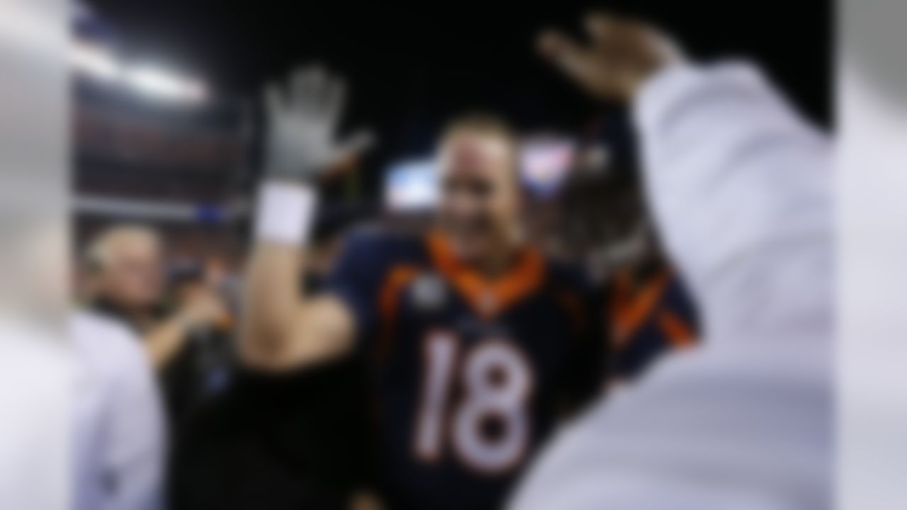 Denver Broncos quarterback Peyton Manning (18) celebrates his 509th career touchdown pass to set the all time record during the first half of an NFL football game against the San Francisco 49ers on Sunday, Oct. 19, 2014, in Denver. Manning has broken Brett Favre's record for touchdown passes with his 509th. The Broncos won the game, 42-17. (Ric Tapia/NFL)