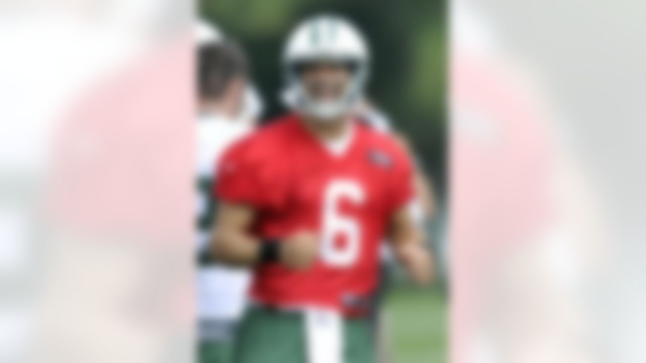 New York Jets quarterback Mark Sanchez reacts during practice on opening day of their NFL football training camp Friday, July 27, 2012, in Cortland, N.Y. (AP Photo/Bill Kostroun)