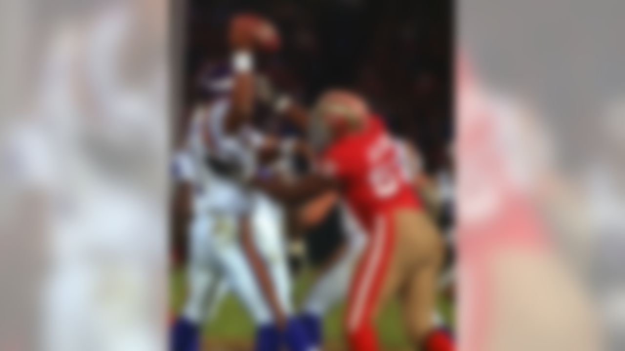 San Francisco 49ers linebacker Rickey Jackson (57) sacks Minnesota Vikings quarterback Warren Moon (1) during a matchup beween the 49ers and Vikings at Candlestick Park on Monday, December 18, 1995 in San Francisco. (AP Photo/Al Golub)