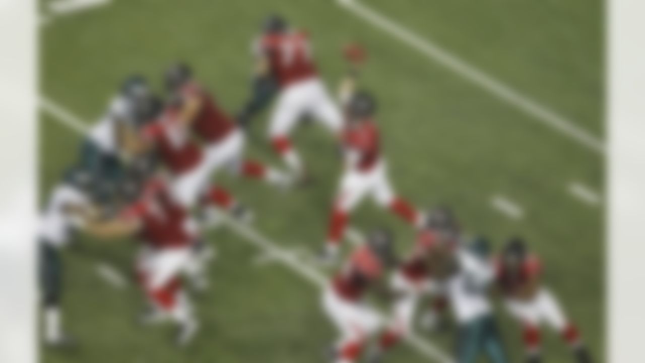 Atlanta Falcons quarterback Matt Ryan (2) looks for a receiver in the second half of an NFL football game against the Philadelphia Eagles at the Georgia Dome in Atlanta on Sunday, Sept. 18, 2011. (AP Photo/Butch Dill)