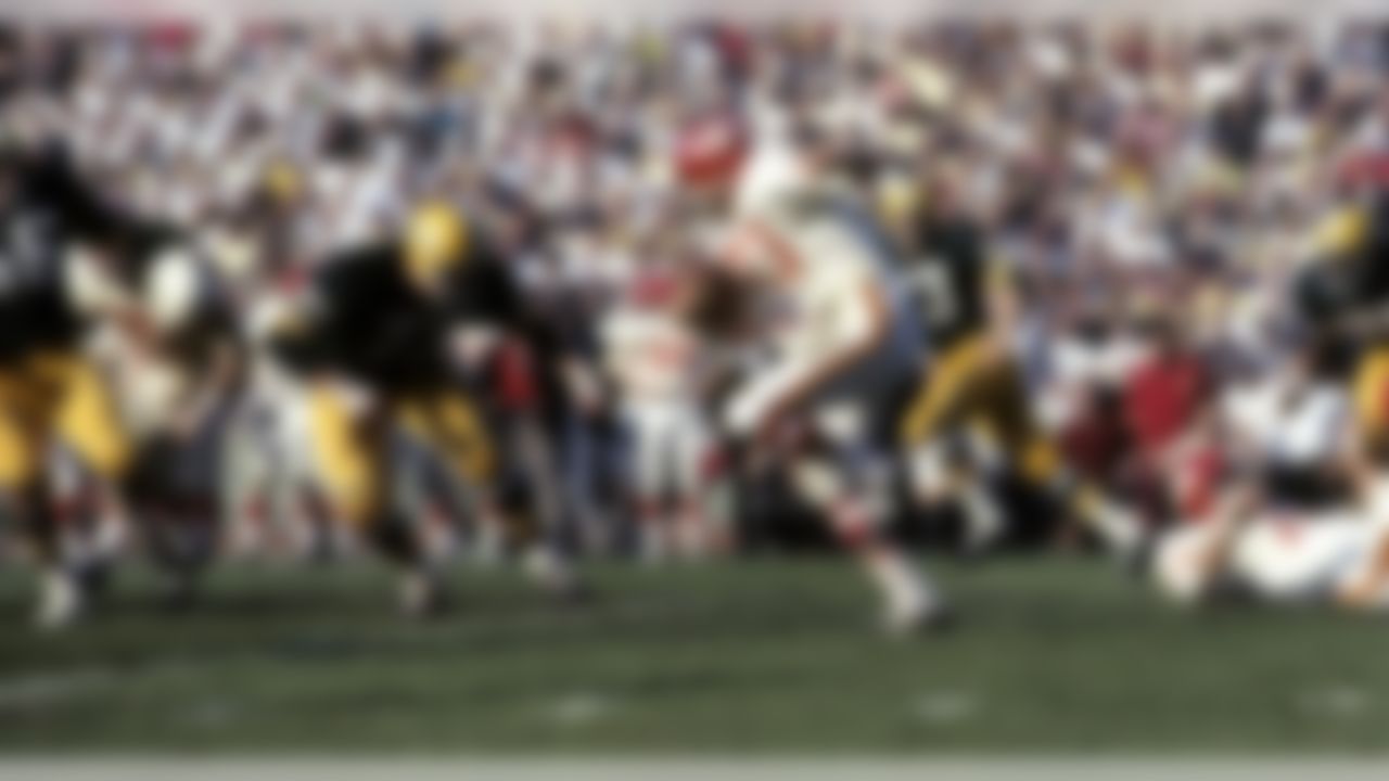 Kansas City Chiefs running back Bert Coan (23) carries the ball as Green Bay Packers defensive tackle Jim Weatherwax (73) tracks him down during Super Bowl I on January 15, 1967, at the Los Angeles Memorial Coliseum. (National Football League)