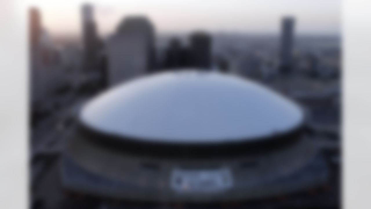 The sun rises over the repaired roof of the Superdome in New Orleans on Monday, Aug. 28, 2006, one year after it was heavily damaged by Hurricane Katrina. The stadium served as a shelter for thousands. (AP Photo/Alex Brandon)