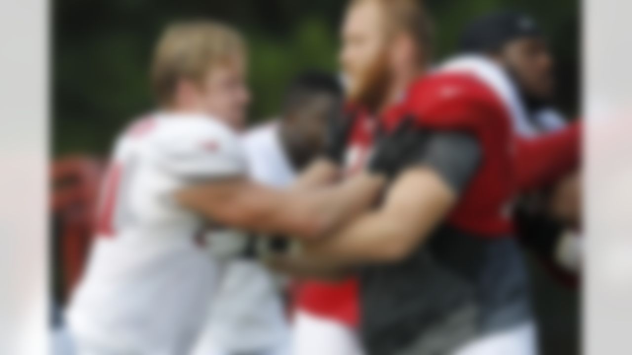 Atlanta Falcons defensive end Kroy Biermann, left, works against offensive lineman Sam Baker during NFL football training camp in Flowery Branch, Ga., Tuesday, July 31, 2012. (AP Photo/John Bazemore)