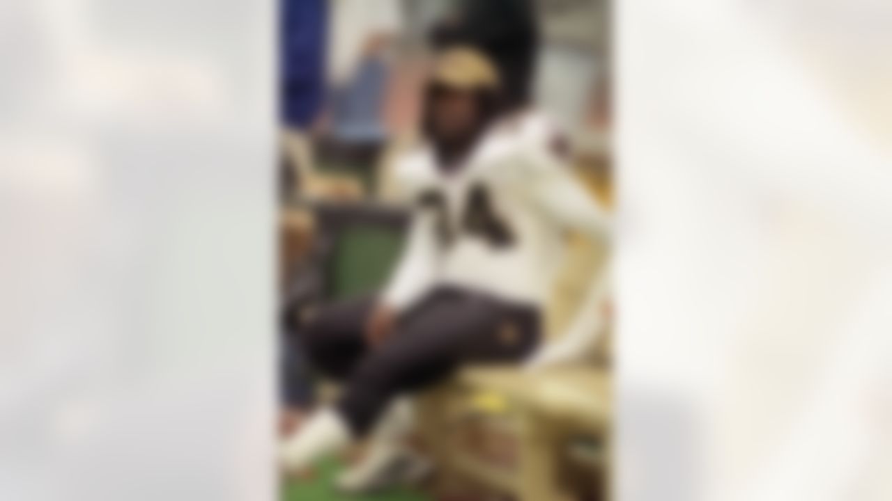 New Orleans Saints Ricky Williams takes a break on the sideline in a game verse the Carolina Panthers on Sunday December 10, 2000 in Charlotte,N.C. CA. (AP Photo/Kevin Reece)