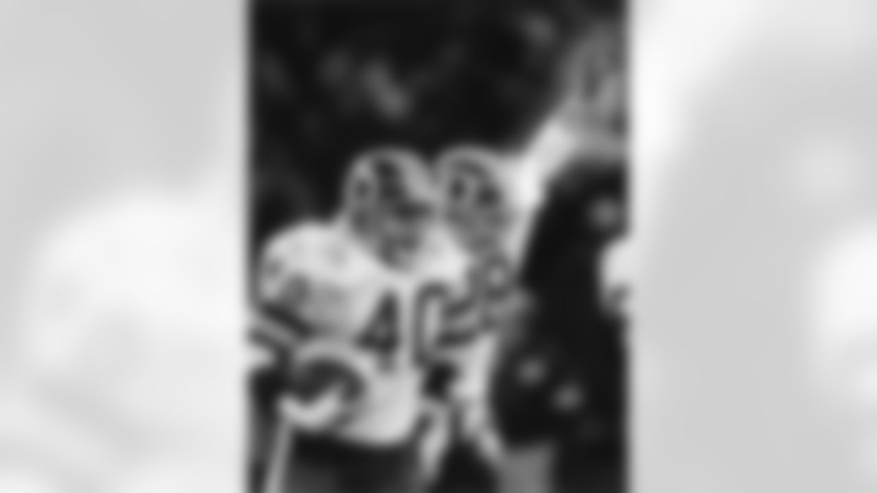 Washington Redskins safety Alvin Walton (40) leaves the field after intercepting a pass while cornerback Darrell Green (28) celebrates during the Redskins 19-7 victory over the Los Angeles Rams in the 1986 NFC Wild Card Playoff Game on December 28, 1986 at RFK Stadium in Washington, D.C. (Photo by Al Messerschmidt/NFL)
