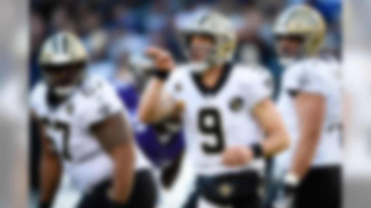 New Orleans Saints quarterback Drew Brees (9) directs his teammates before running a play in the first half of an NFL football game against the Baltimore Ravens, Sunday, Oct. 21, 2018, in Baltimore.