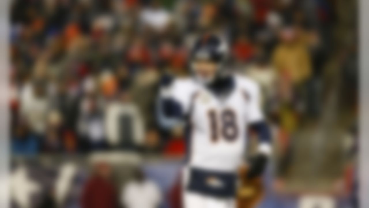 Denver Broncos quarterback Peyton Manning (18) celebrates after throwing a touchdown pass during an NFL football game against the New England Patriots at Gillette Stadium on Sunday November 24, 2013 in Foxborough, Massachusetts. (Aaron M. Sprecher/NFL)