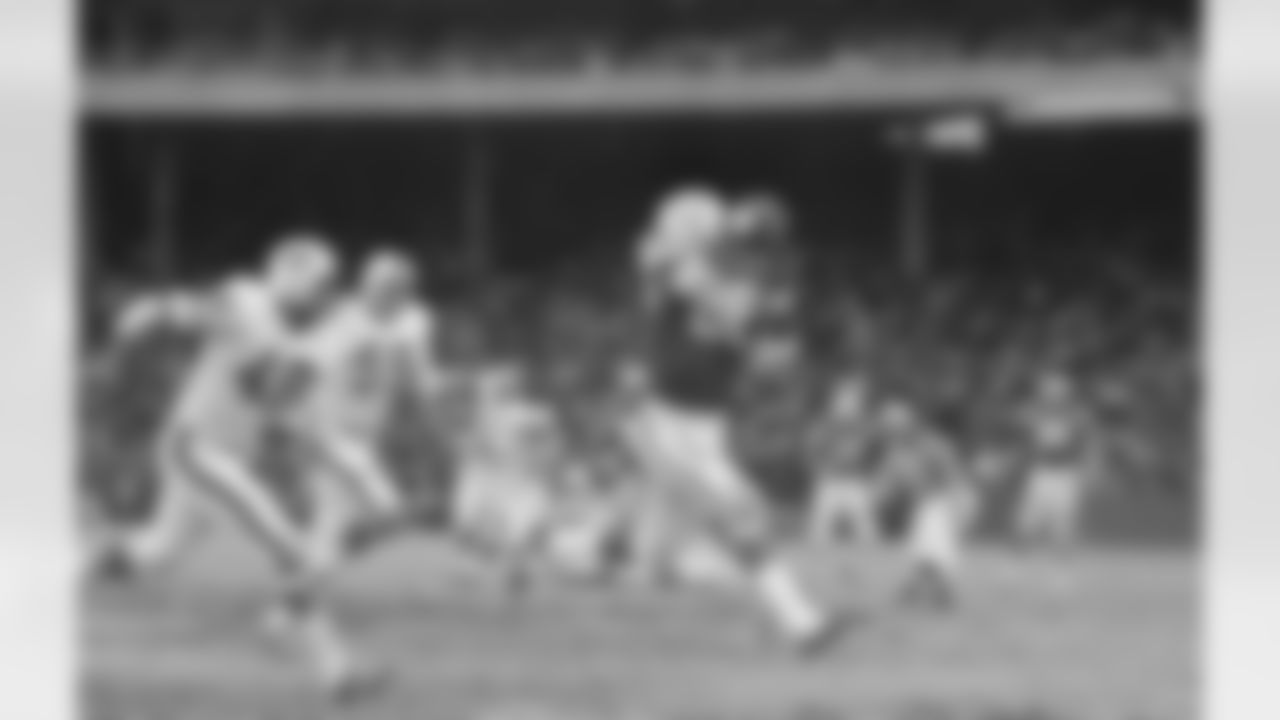 This Nov. 15, 1970 file photo shows Baltimore Colts tight end John Mackey catching a pass from John Unitas for a touchdown as Buffalo Bills defenders John Pitts (48) and linebacker Paul Guidry (59) pursue, in Baltimore. (Associated Press)