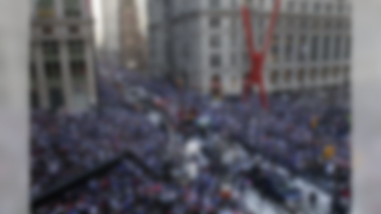 The New York Giants make their way up Broadway during the team's NFL football Super Bowl parade in New York, Tuesday, Feb. 7, 2012. The Giants returned from their Super Bowl win to a celebration the likes that only New York can throw: a ticker-tape parade in the Canyon of Heroes on Broadway, where the city has honored stars for almost a century. (AP Photo/Seth Wenig)
