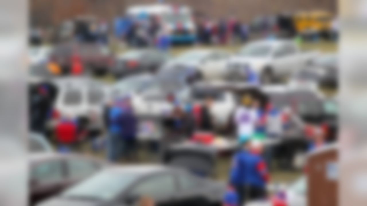 People tailgate outside of Ralph Wilson Stadium prior to an NFL football game between the Buffalo Bills and the Cleveland Browns, Sunday, Nov. 30, 2014, in Orchard Park, N.J. (AP Photo/Bill Wippert)