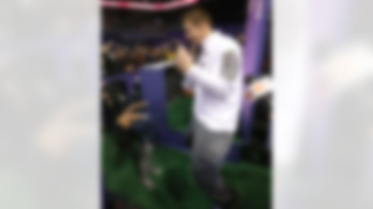 New England Patriots tight end Rob Gronkowski dances with a young fan during Media Day for Super Bowl XLIX at the U.S. Airways Center on Tuesday, January 27, 2015 in Phoenix, AZ. (Perry Knotts/NFL)