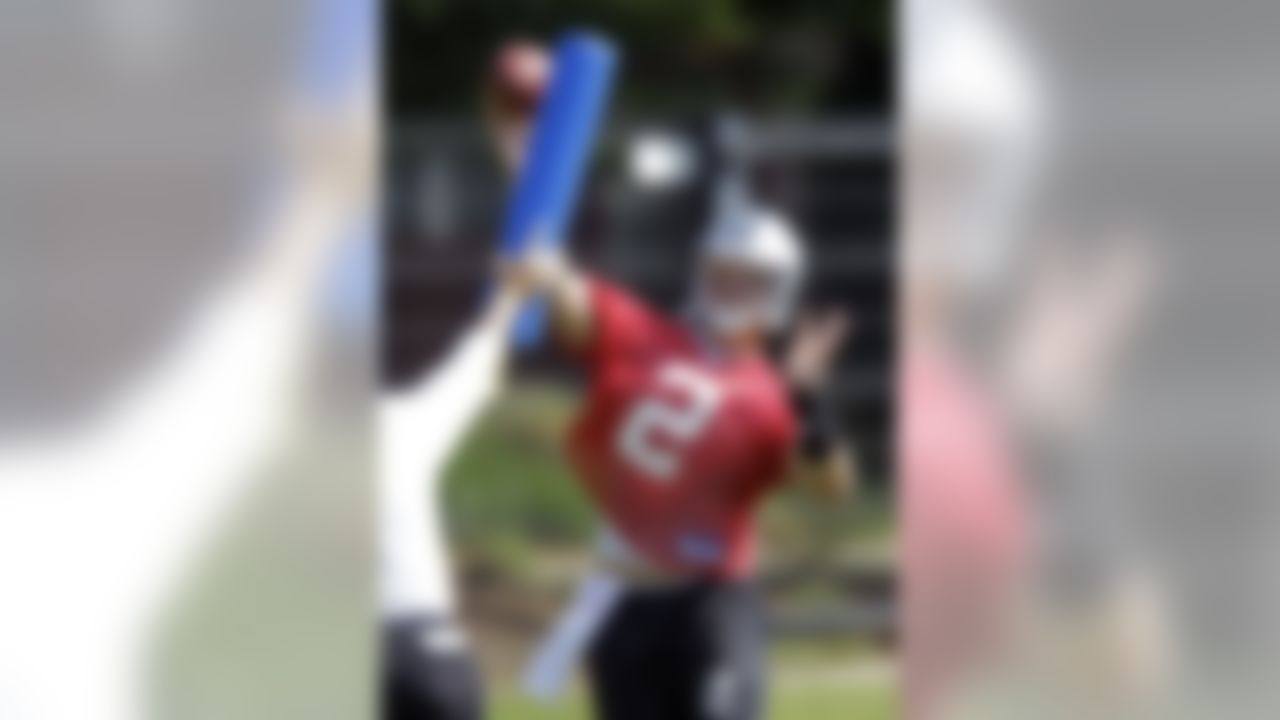 Carolina Panthers' Jimmy Clausen throws a pass during a summer training session practice for the NFL football team in Charlotte, N.C., Monday, June 14, 2010. From a high school star to his limousine arrival at Notre Dame to quarterbacking the Fighting Irish, Jimmy Clausen has lived in the spotlight. Here with the Carolina Panthers, at least for now, the attention is on others, allowing Clausen to learn the pro game more quietly. (AP Photo/Chuck Burton)