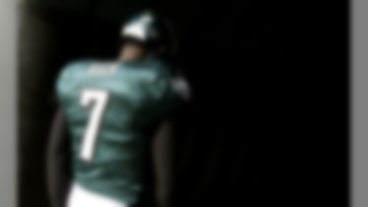 In this Nov. 13, 2011 photo, Philadelphia Eagles quarterback Michael Vick walks onto the field before an NFL football game against the Arizona Cardinals in Philadelphia. The Eagles, who were conceded to have "won" free agency with the signings of a number of prize players, struggled to develop the chemistry necessary to make a playoff push and now find themselves on the verge of their own offseason. (AP Photo/Matt Slocum, File)