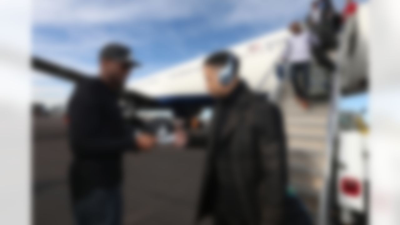 Seattle Seahawks free safety Earl Thomas (29) receives a hat as he arrives at Sky Harbor Airport for NFL Super Bowl XLIX football game Sunday, Jan. 25, 2015, in Phoenix. The Seahawks play the New England Patriots in Super Bowl XLIX on Sunday, Feb. 1, 2015. (Perry Knotts/NFL)