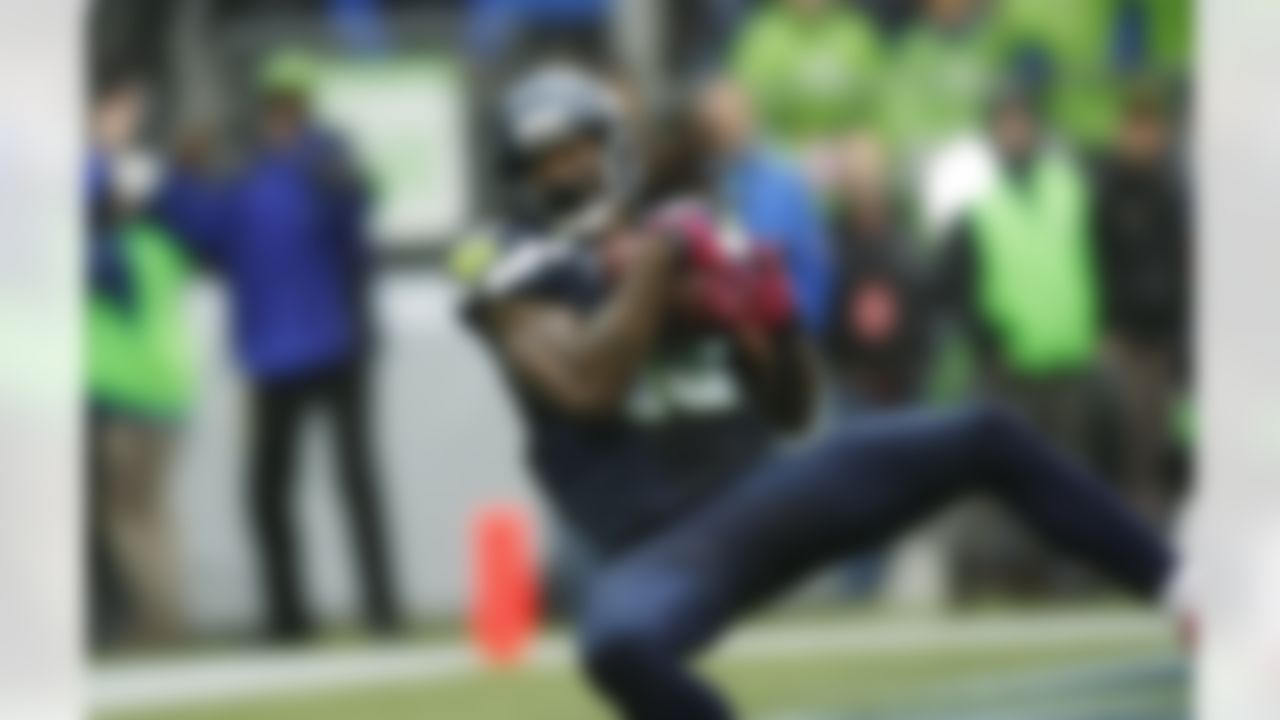 Seattle Seahawks' Sidney Rice comes down with a game-winning touchdown reception in the second half of an NFL football game against the New England Patriots, Sunday, Oct. 14, 2012, in Seattle. The Seahawks beat the Patriots, 24-23. (AP Photo/John Froschauer)