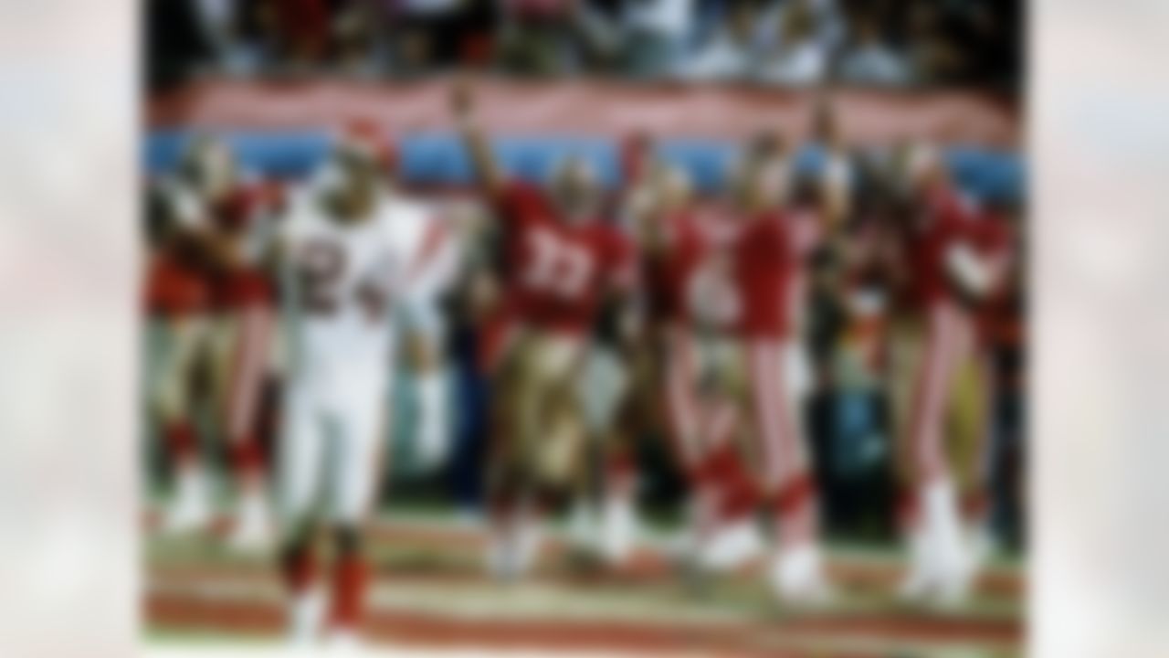 San Francisco 49ers Joe Montana (16), John Taylor (82) and Roger Craig (33) celebrate Taylor's game-winning 10-yard touchdown reception in the final moments of the 49ers 20-16 victory over the Cincinnati Bengals in Super Bowl XXIII on January 22, 1989 at Joe Robbie Stadium in Miami, Florida. (National Football League)