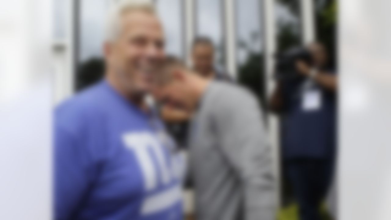 New York Giants co-owner Steve Tisch, left, and Giants punter Steve Weatherford share a laugh at the Giants football training camp in Albany, N.Y., Friday, July 27, 2012. (AP Photo/Kathy Willens)