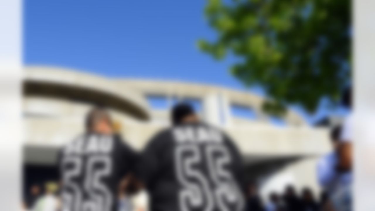 May 11, 2012; San Diego, CA, USA; Andres Miera (left) and Jose Irusta of San Diego wait outside Qualcomm Stadium before a celebration of life service to remember former San Diego Chargers player Junior Seau. Mandatory Credit: Christopher Hanewinckel-US PRESSWIRE
