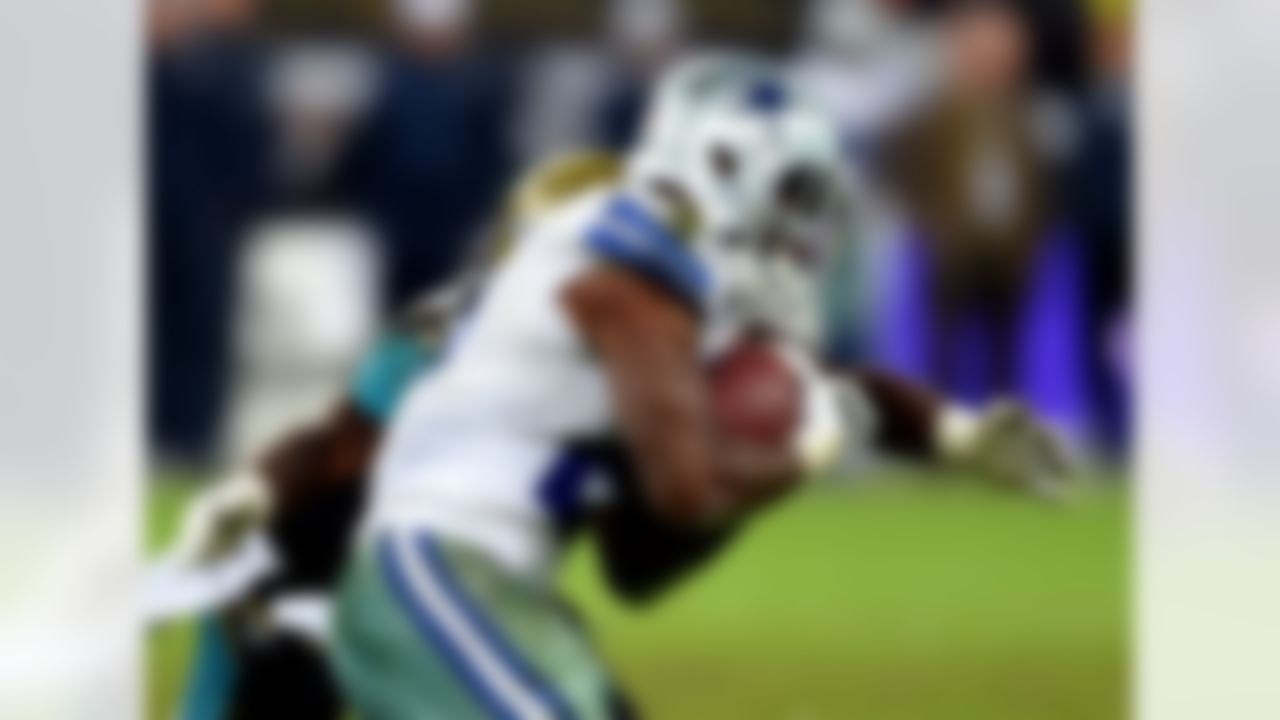 Jacksonville Jaguars linebacker J.T. Thomas tries to stop Dallas Cowboys running back Joseph Randle during the second half of their NFL football game at Wembley Stadium, London, Sunday, Nov. 9, 2014. (AP Photo/Tim Ireland)